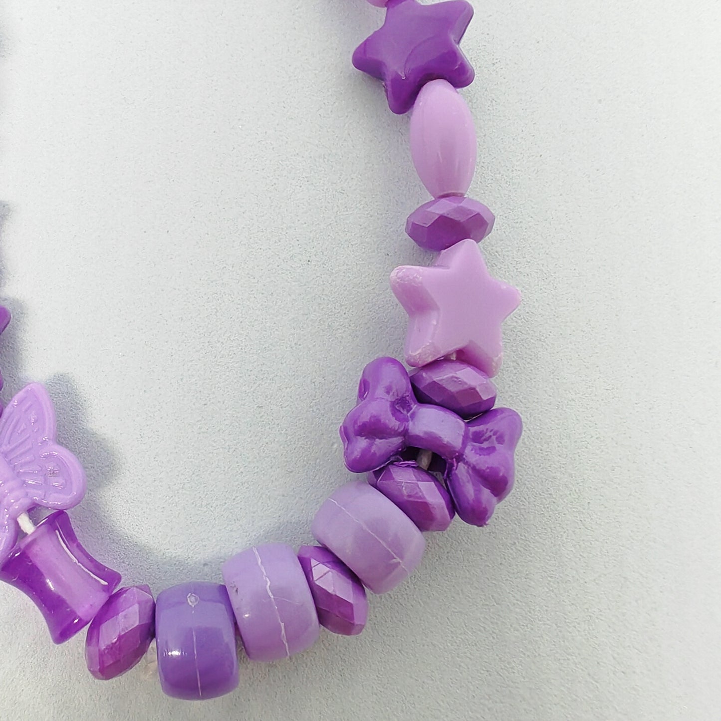 MALICIEUSE - grigri de téléphone (petit) - mauve